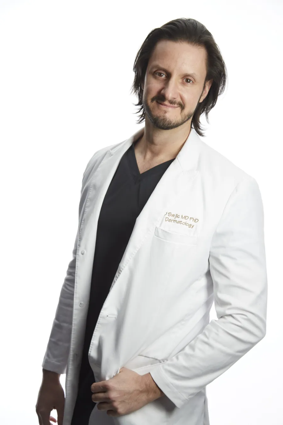 Dr. Dusan Sajic in his white coat